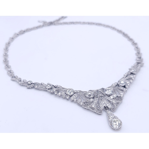 30 - A Majestic Art Deco 7ctw Diamond (approx) Platinum Lavaliere Necklace. Scrolled and foliate decorati... 