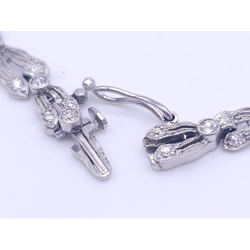 30 - A Majestic Art Deco 7ctw Diamond (approx) Platinum Lavaliere Necklace. Scrolled and foliate decorati... 