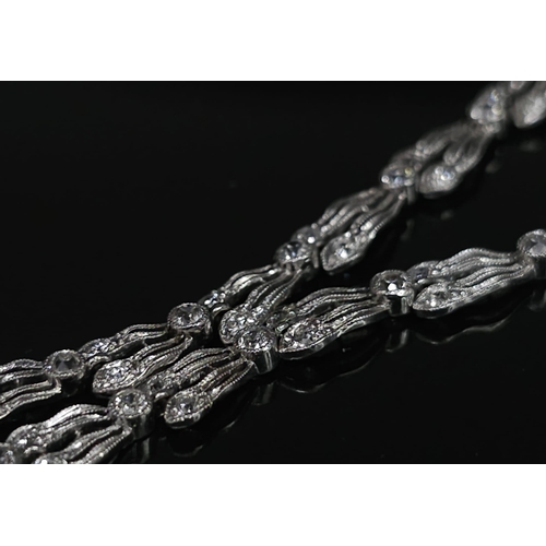 30 - A Majestic Art Deco 7ctw Diamond (approx) Platinum Lavaliere Necklace. Scrolled and foliate decorati... 