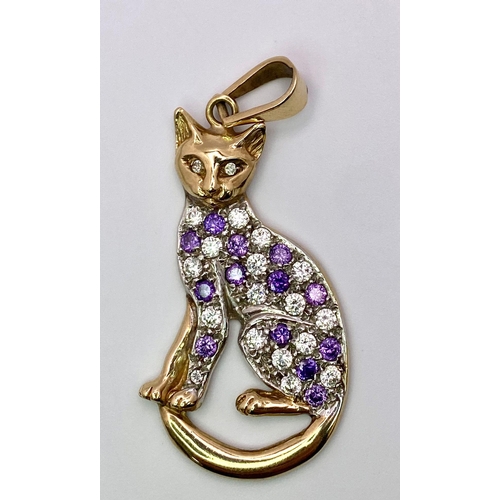 305 - A 9K Yellow Gold Amethyst and White Stone Decorative Cat Pendant. 6cm. 9.75g total weight.