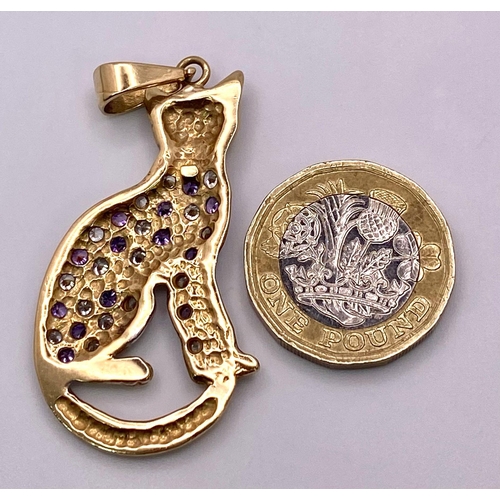 305 - A 9K Yellow Gold Amethyst and White Stone Decorative Cat Pendant. 6cm. 9.75g total weight.