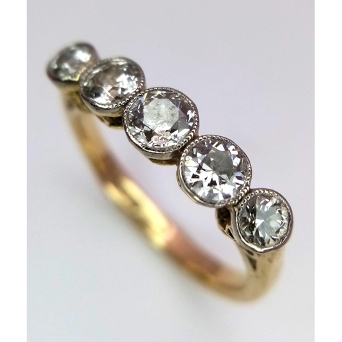 311 - A Vintage 9K Yellow Gold - Five Diamond Ring. 1.4ctw approx of brilliant round cut diamonds. Size P.... 