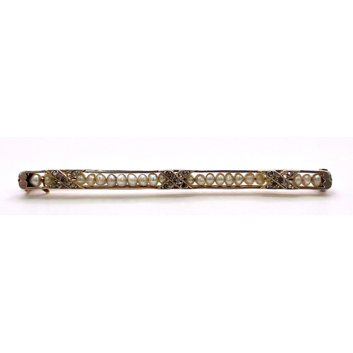 319 - An Antique Mid-Karat Gold, Pearl and Diamond Bar Brooch.
6.5cm length. 5.24g total weight.