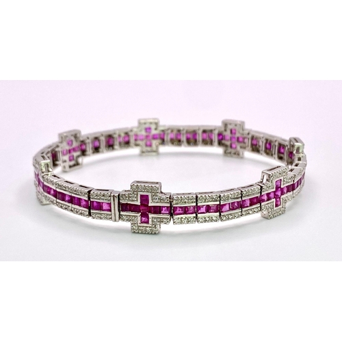 37 - A Captivating 18K White Gold, Ruby and Diamond Ladies Tennis Bracelet. 112 Square cut rubies and 300... 