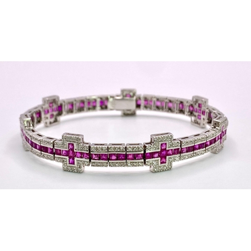 37 - A Captivating 18K White Gold, Ruby and Diamond Ladies Tennis Bracelet. 112 Square cut rubies and 300... 