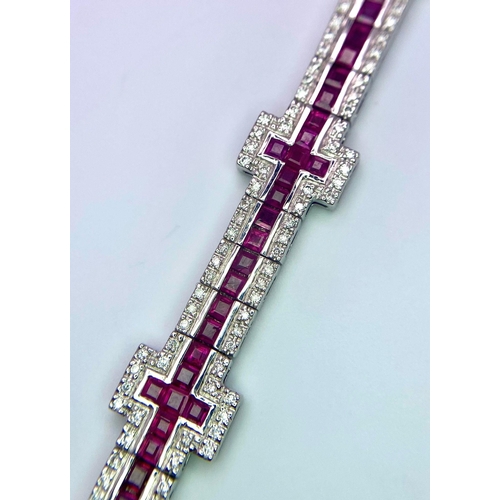 37 - A Captivating 18K White Gold, Ruby and Diamond Ladies Tennis Bracelet. 112 Square cut rubies and 300... 