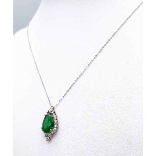 513 - An 18K White Gold, Emerald and Diamond Teardrop Pendant on a 9K White Gold Disappearing Necklace. Pe... 