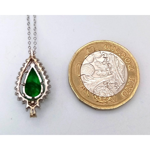 513 - An 18K White Gold, Emerald and Diamond Teardrop Pendant on a 9K White Gold Disappearing Necklace. Pe... 