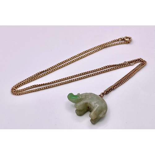 898 - A Jade Hippopotamus Pendant on a 9K Yellow Gold Necklace. 
2cm pendant. 42cm necklace. 8.53g total w... 