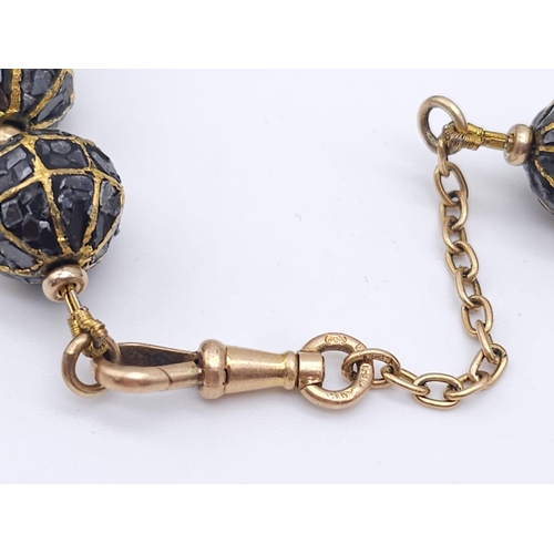 99 - An Antique 18K Rose Gold and Diamond Encrusted Ball Necklace. Graduating golden balls filled with ro... 