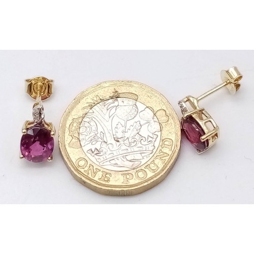 1073 - A Pair of 10K Yellow Gold Diamond and Ruby Stud Earrings. 
2g total weight.