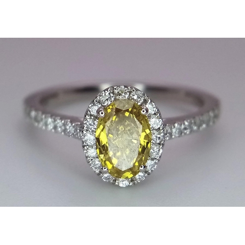 226 - A 950 Platinum Ring set with an Oval Cut Natural Fancy Vivid Yellow Central Diamond (VS2 clarity) wi... 