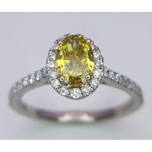 226 - A 950 Platinum Ring set with an Oval Cut Natural Fancy Vivid Yellow Central Diamond (VS2 clarity) wi... 