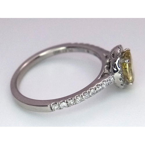 226 - A 950 Platinum Ring set with an Oval Cut Natural Fancy Vivid Yellow Central Diamond (VS2 clarity) wi... 