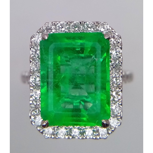 240 - A Rare Transparent Green Rectangular Cut Natural  Colombian Emerald and Diamond Ring. A 6.19ct centr... 