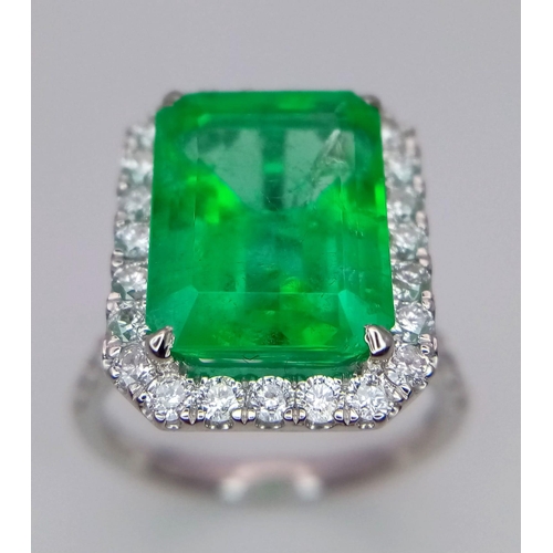 240 - A Rare Transparent Green Rectangular Cut Natural  Colombian Emerald and Diamond Ring. A 6.19ct centr... 