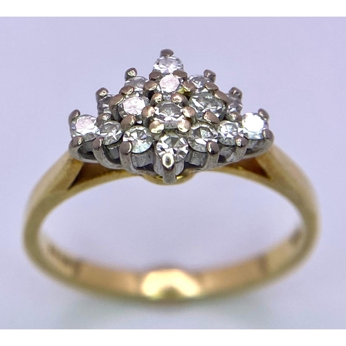 257 - AN 18K GOLD DIAMOND CLUSTER RING WITH .35ct DIAMOND .    3.1gms   size M