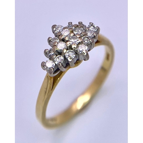 257 - AN 18K GOLD DIAMOND CLUSTER RING WITH .35ct DIAMOND .    3.1gms   size M