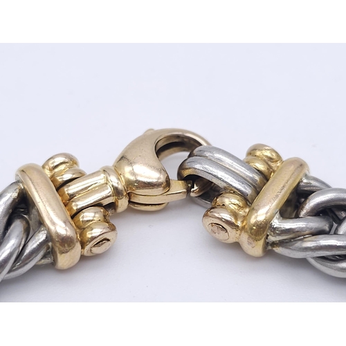 562 - A Beautifully Constructed Platinum and 18K Gold (tested) Curb Link Bracelet. 18cm. 50.3g total weigh... 