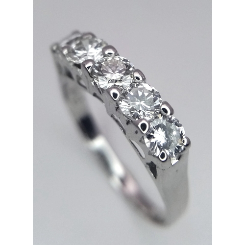 583 - An 18K White Gold and Five Stone Diamond Ring. Quality brilliant round cut diamonds - near white. Si... 