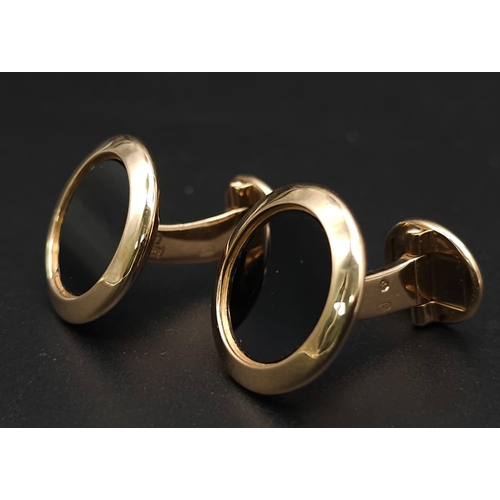 859 - A Classic Pair of Patek Philippe 18K Gold and Onyx Cufflinks. 
Excellent condition. 18mm at diameter... 