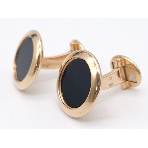 859 - A Classic Pair of Patek Philippe 18K Gold and Onyx Cufflinks. 
Excellent condition. 18mm at diameter... 