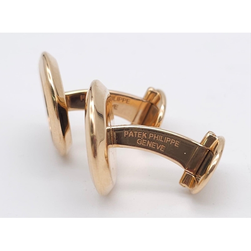 859 - A Classic Pair of Patek Philippe 18K Gold and Onyx Cufflinks. 
Excellent condition. 18mm at diameter... 