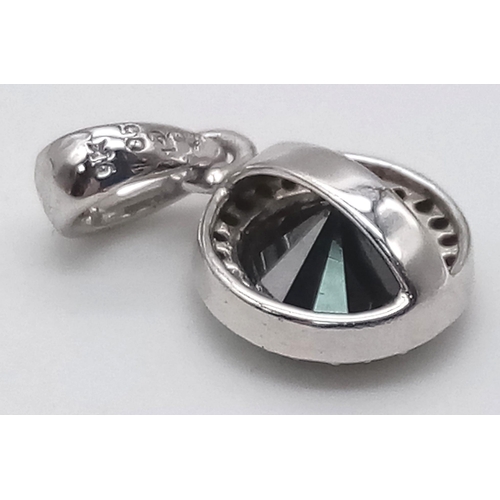 1465 - An interesting 9 K white gold pendant with a black round cut diamond (1.05 carat) surrounded by nume... 