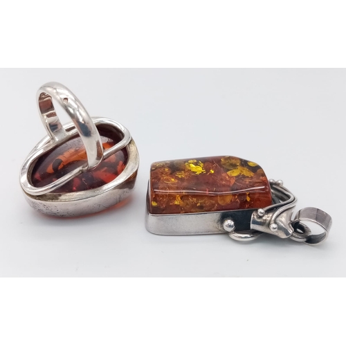 1694 - A STERLING SILVER AMBER SET RING. SIZE R & A STERLING SILVER AMBER SET PENDANT. 35.4G IN TOTAL WEIGH... 