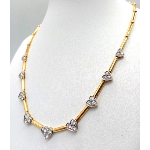 752 - A Gorgeous 18K Gold and Heart-Diamond Necklace and Bracelet Set. The necklace is decorated with grad... 