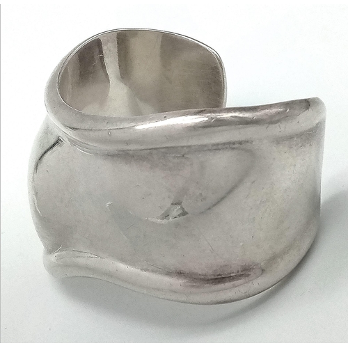 1070 - A 925 silver Tiffany & Co cuff bangle. Total weight 55.6G. Widest inner Length 6cm.