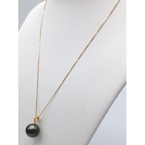 1185 - A Large Tahitian Black Pearl, 18K Gold and Diamond Pendant on a 9K Yellow Gold Disappearing Necklace... 