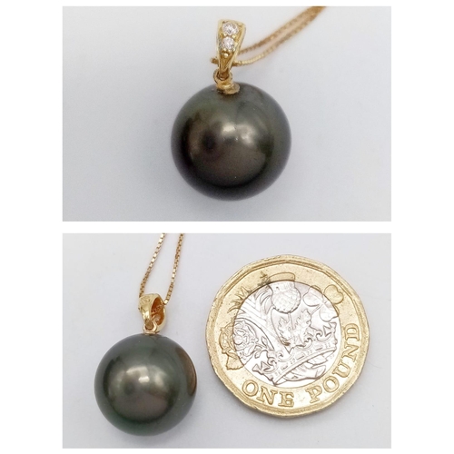 1185 - A Large Tahitian Black Pearl, 18K Gold and Diamond Pendant on a 9K Yellow Gold Disappearing Necklace... 