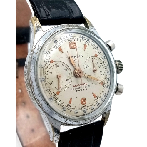 1227 - A Rare Vintage Lemania 105 Chronograph Gents Watch. 1275 Calibre. Black leather strap. Stainless ste... 