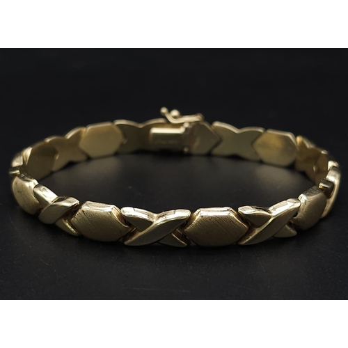 127 - A Stylish Italian 14K Yellow Gold Hexagonal and X-Link Bracelet. 18cm. 11.9g weight.