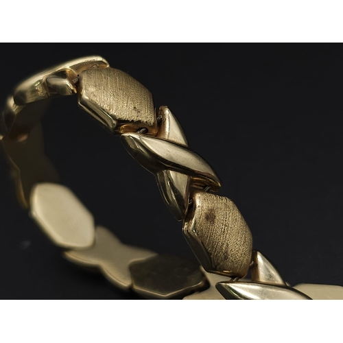 127 - A Stylish Italian 14K Yellow Gold Hexagonal and X-Link Bracelet. 18cm. 11.9g weight.