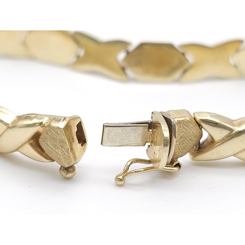 127 - A Stylish Italian 14K Yellow Gold Hexagonal and X-Link Bracelet. 18cm. 11.9g weight.