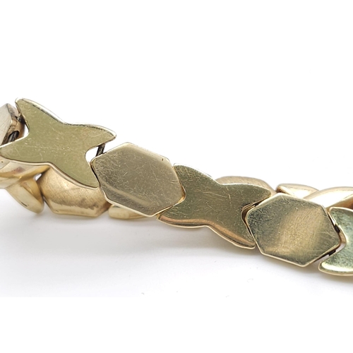 127 - A Stylish Italian 14K Yellow Gold Hexagonal and X-Link Bracelet. 18cm. 11.9g weight.