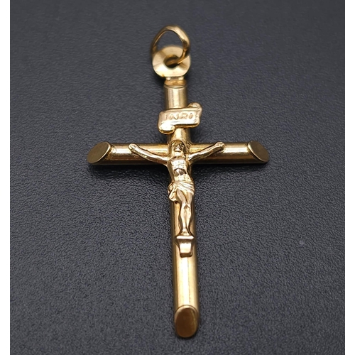 1691 - A 9K Yellow Gold Crucifix Pendant. 3cm x 2cm. 1.1g weight.