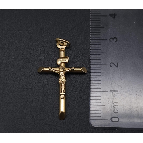 1691 - A 9K Yellow Gold Crucifix Pendant. 3cm x 2cm. 1.1g weight.