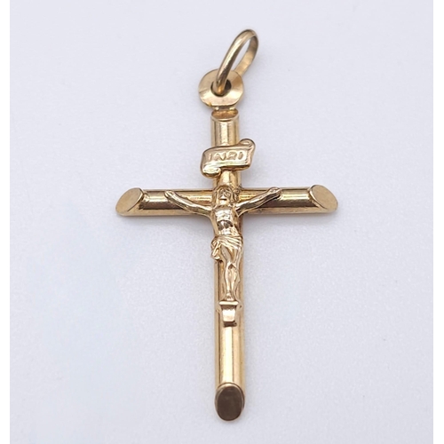 1691 - A 9K Yellow Gold Crucifix Pendant. 3cm x 2cm. 1.1g weight.