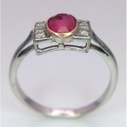 179 - A VINTAGE 18K WHITE GOLD DIAMOND & RUBY RING. Size Q, 2.5g total weight.