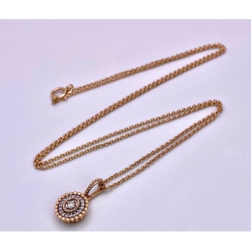 214 - A 14K ROSE GOLD DIAMOND SET PENDANT ON CHAIN. 1.5cm and 49cm, 2.6g total weight.