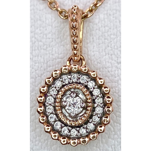 214 - A 14K ROSE GOLD DIAMOND SET PENDANT ON CHAIN. 1.5cm and 49cm, 2.6g total weight.