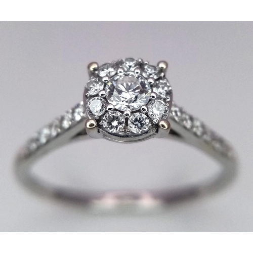 250 - AN 18K WHITE GOLD DIAMOND RING. Size S, 0.60ctw, 3g total weight.