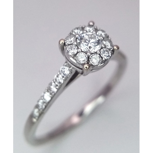 250 - AN 18K WHITE GOLD DIAMOND RING. Size S, 0.60ctw, 3g total weight.