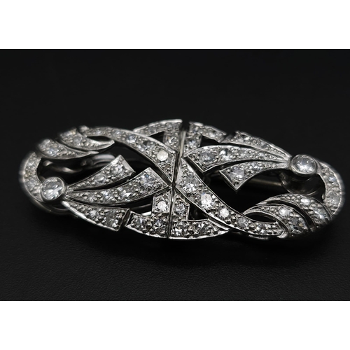 267 - A 1920s Art Deco Platinum and Diamond Duette Brooch. 3.5ctw of bright round cut diamonds. Can be wor... 