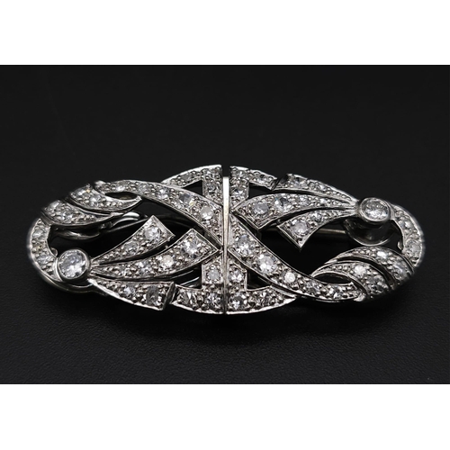 267 - A 1920s Art Deco Platinum and Diamond Duette Brooch. 3.5ctw of bright round cut diamonds. Can be wor... 