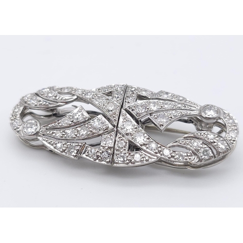 267 - A 1920s Art Deco Platinum and Diamond Duette Brooch. 3.5ctw of bright round cut diamonds. Can be wor... 