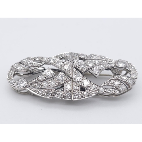 267 - A 1920s Art Deco Platinum and Diamond Duette Brooch. 3.5ctw of bright round cut diamonds. Can be wor... 